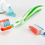 toothpaste and 2 toothbrushes
